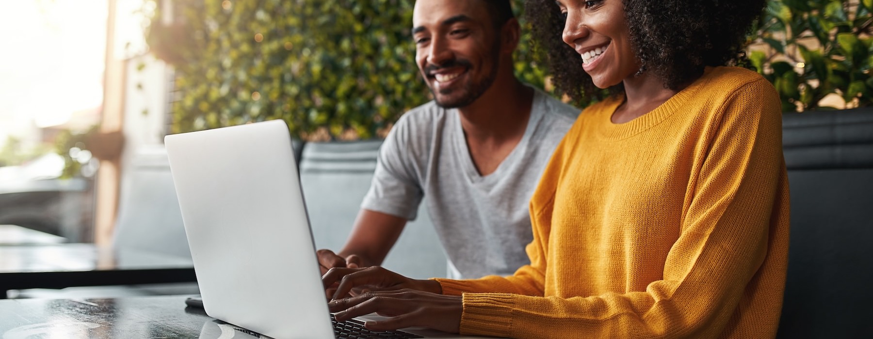 man and woman on laptop